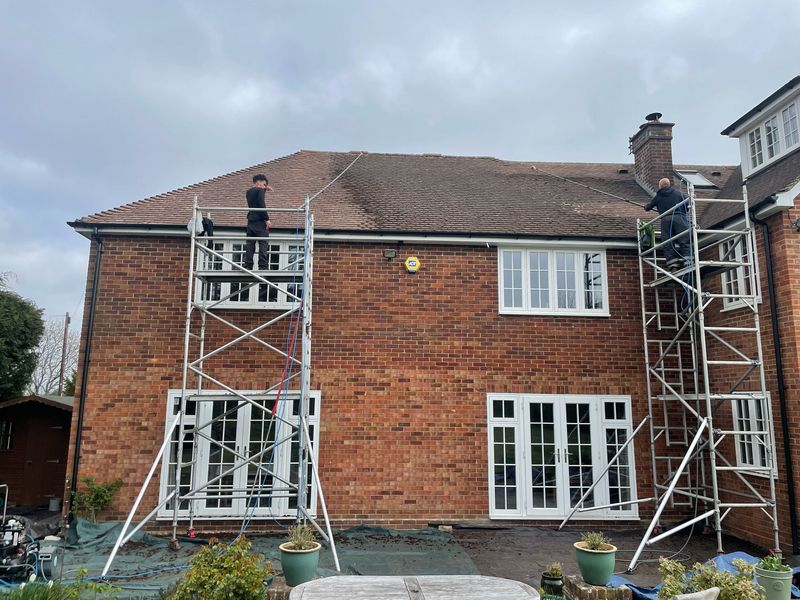 Roof cleaning carried out safely from scaffold towers by The Roof Moss Cleaners in Eastbury